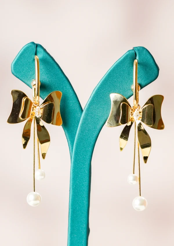 Golden bow dangle earrings